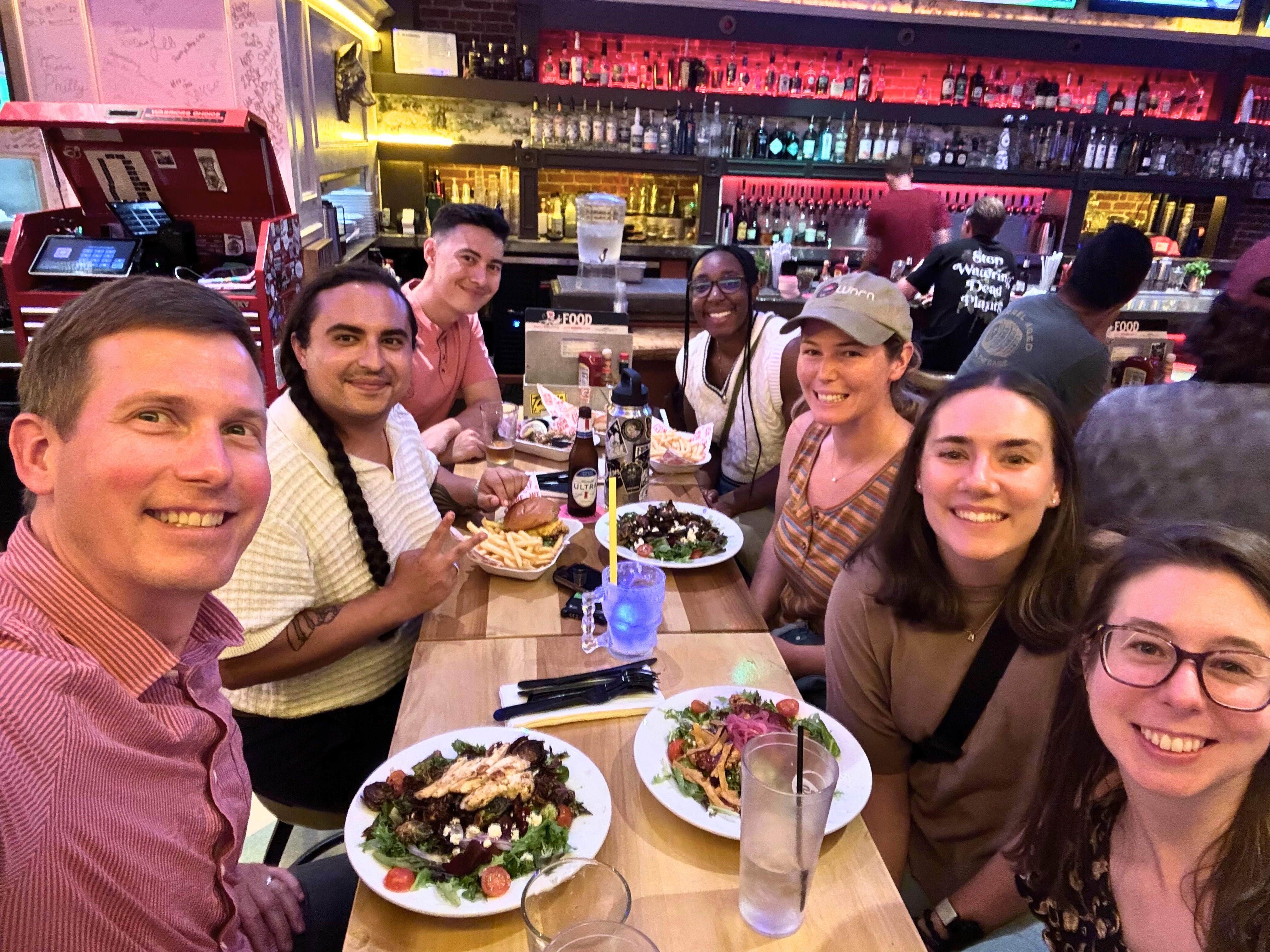 Workshop Digital team members enjoying dinner together during a trip to San Diego.