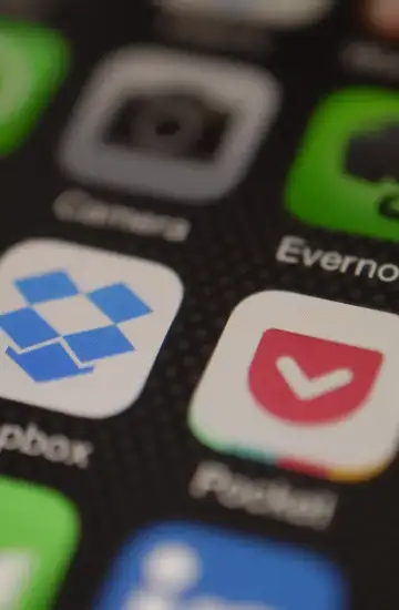 Close-up of mobile phone screen displaying app icons, representing digital marketing strategies for mobile apps..