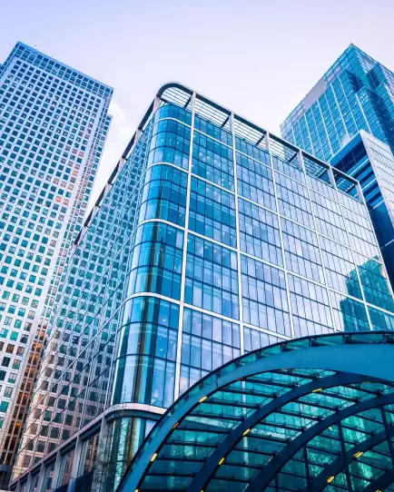 Modern glass office buildings, symbolizing business growth and financial services.