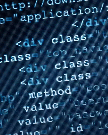 Close-up of HTML code on a screen, highlighting technical SEO and web optimization.