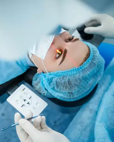 Patient undergoing LASIK eye surgery with a visible laser, symbolizing specialized healthcare marketing results.
