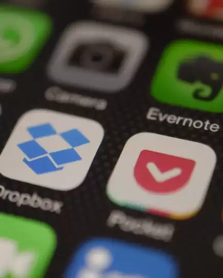 Close-up of mobile phone screen displaying app icons, representing digital marketing strategies for mobile apps..