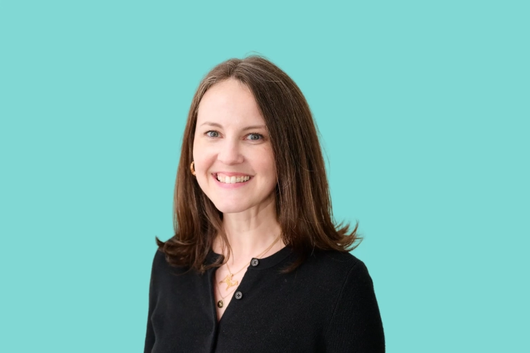 Portrait of Kate Pyle on a teal background.