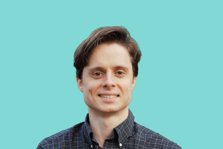 Portrait of Preston Pezzaro on a teal background.